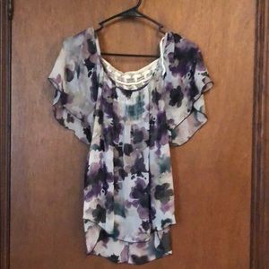 Sheer flower shirt.